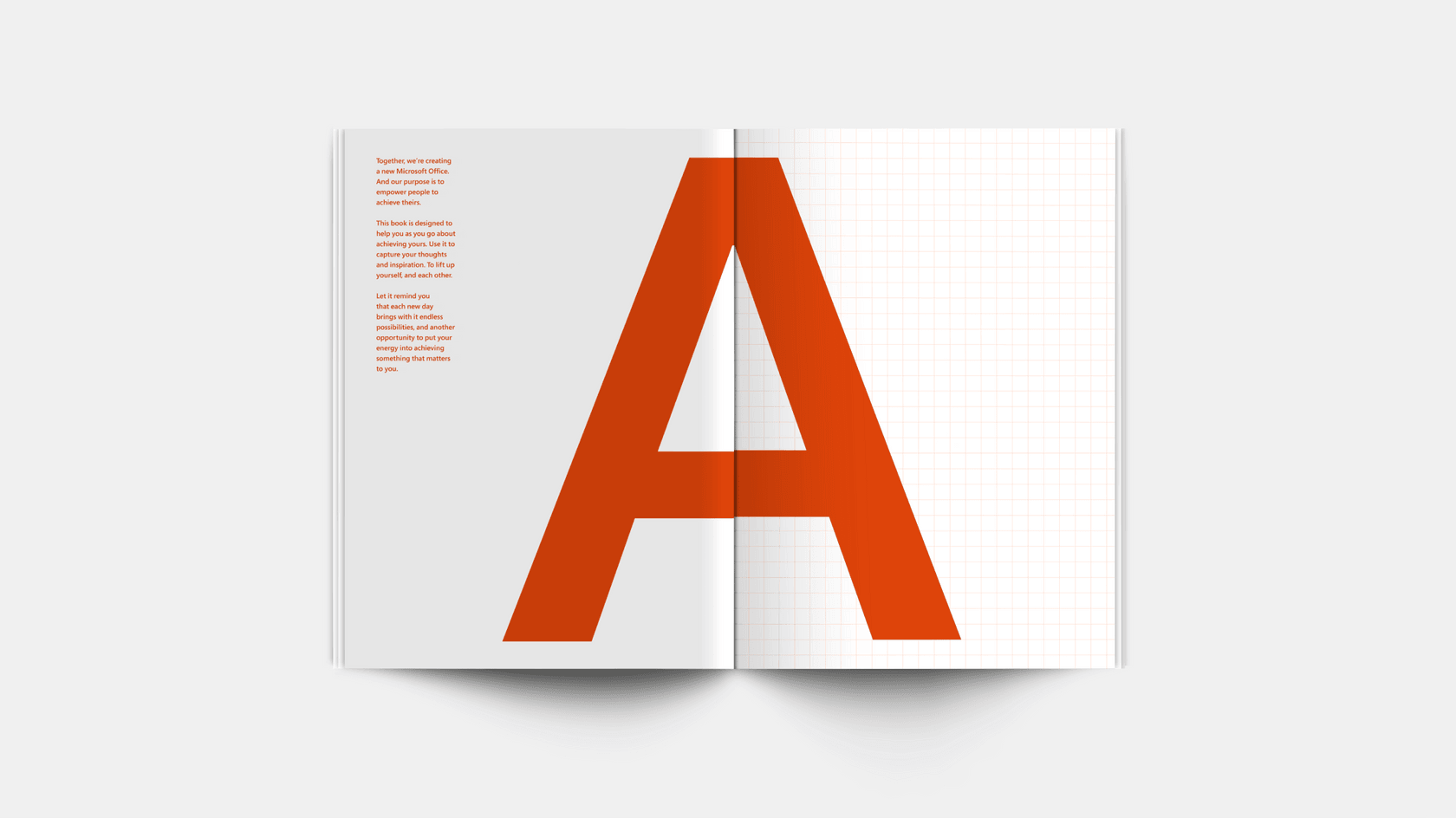 Pages of a square-ruled notebook with a large letter A in orange.